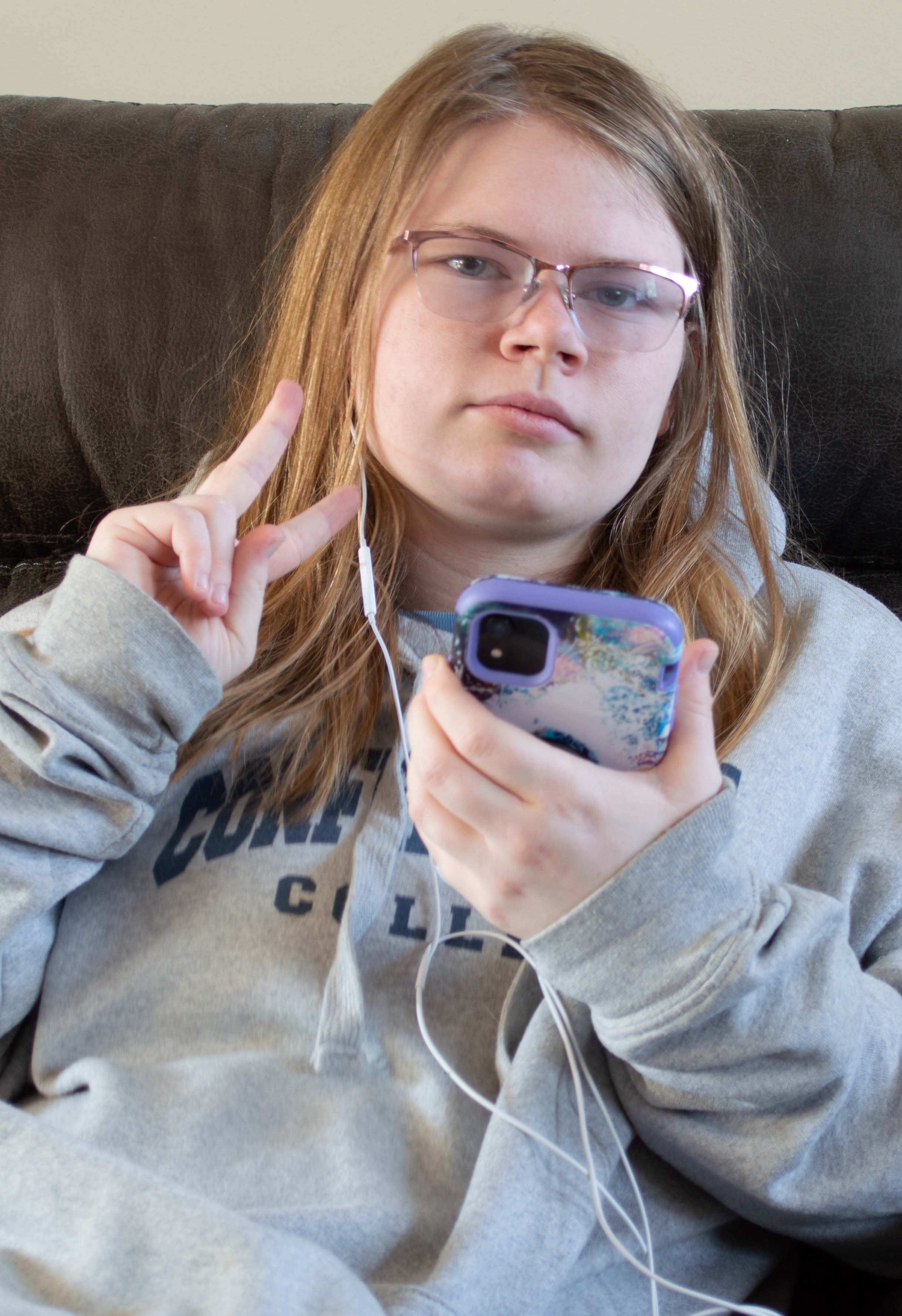 Picture of me (Dirty blonde hair, blued eyes) Sitting on a black leather chair.